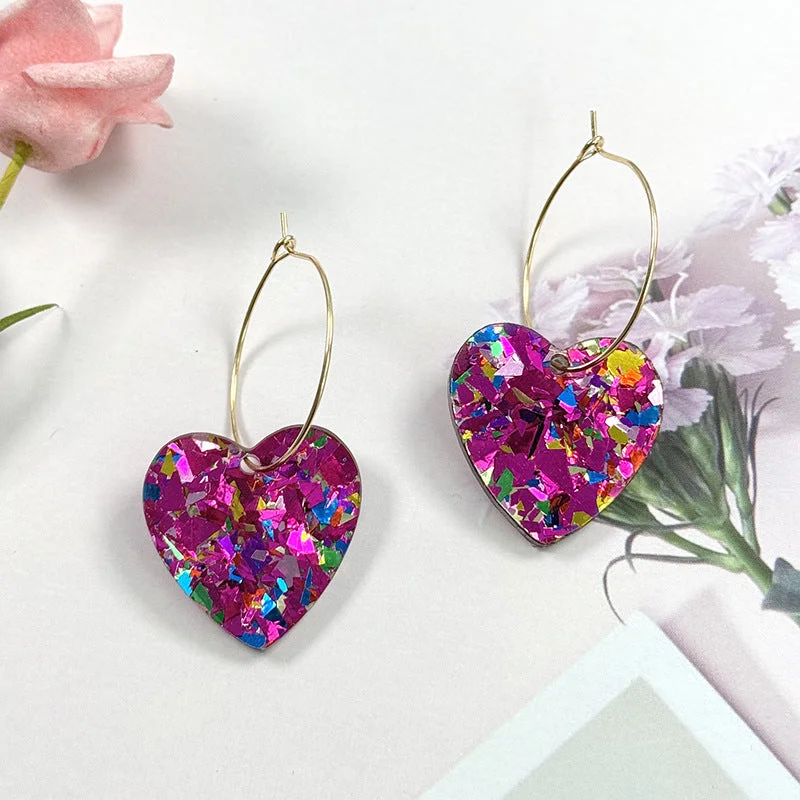 A pair of rose red glitter love earrings